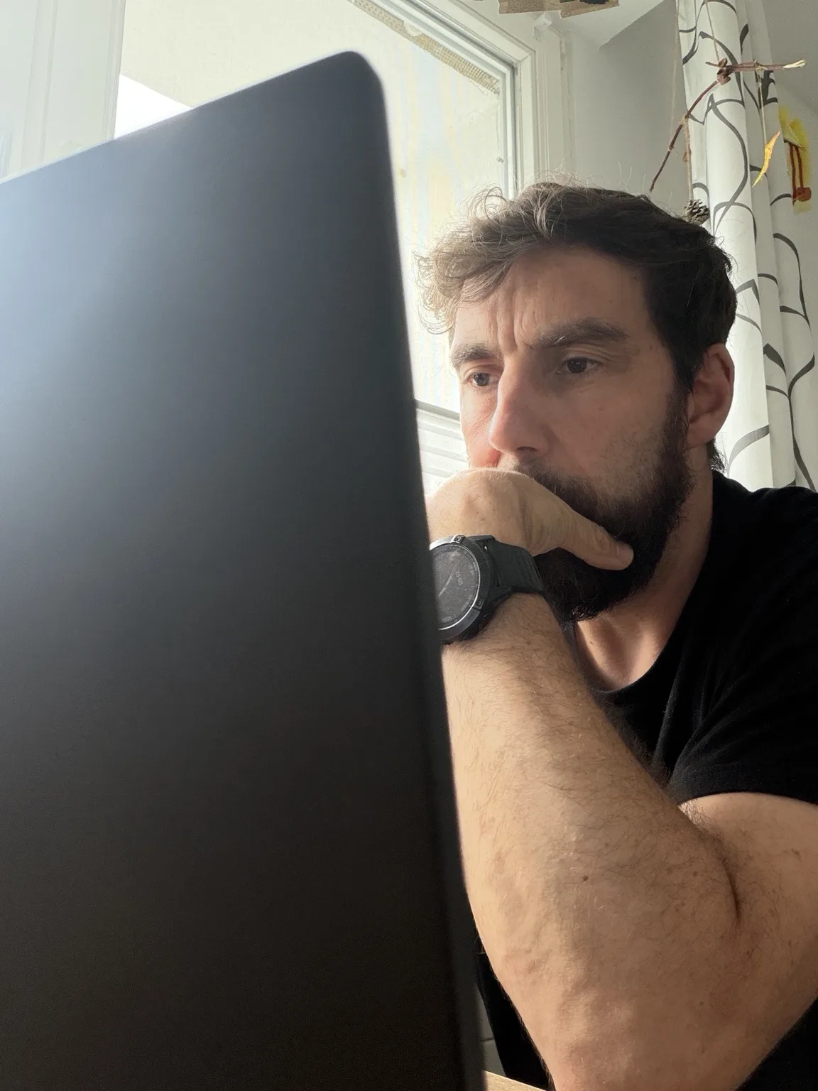 Mirko David working with digital tools and technical information